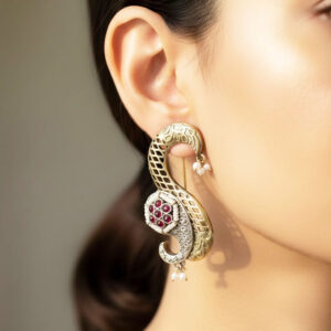exquisite dual tone paisley motif statement earrings with ruby red stones and pearl accents
