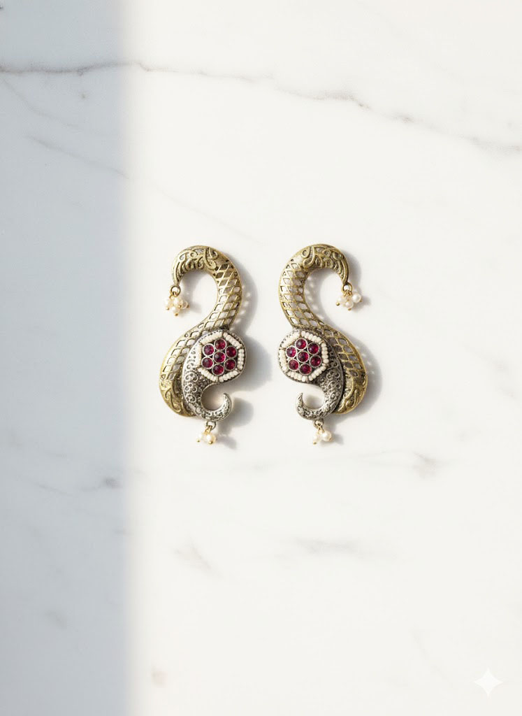 exquisite dual tone paisley motif statement earrings with ruby red stones and pearl accents exquisite dual tone paisley motif statement earrings with ruby red stones and pearl accents