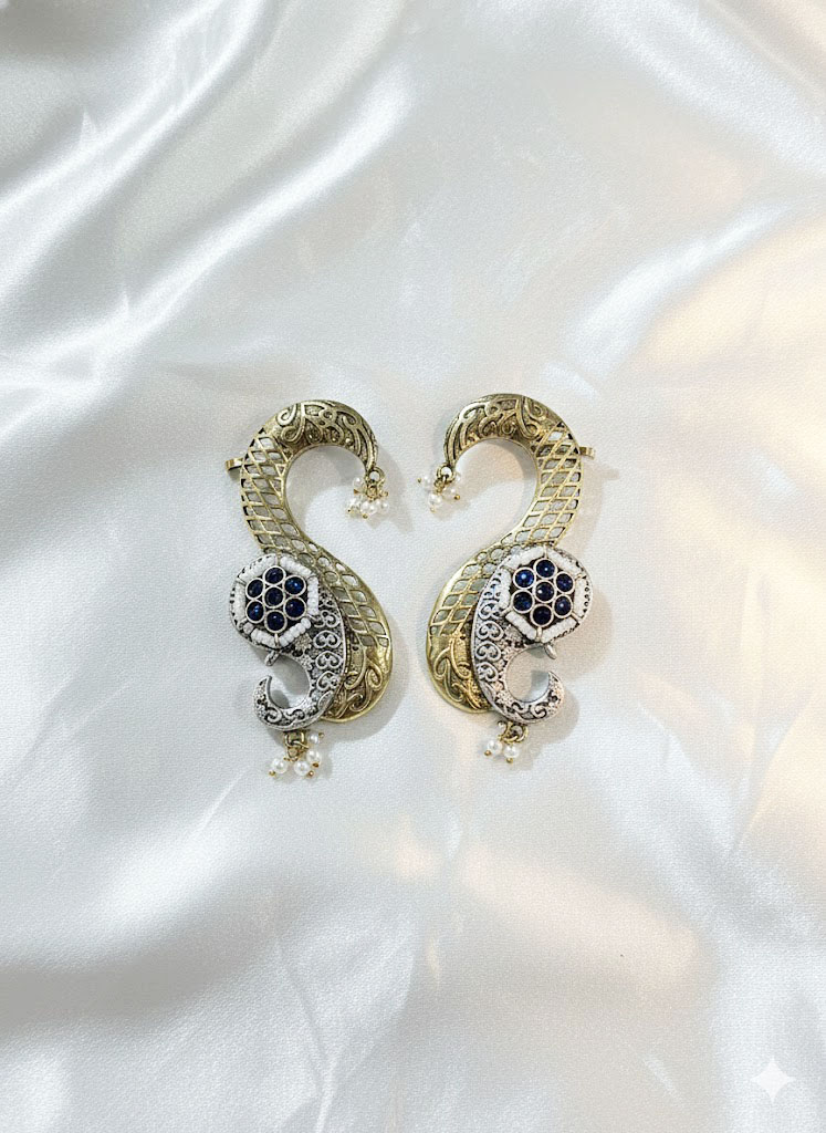 exquisite dual tone paisley motif statement earrings with ruby red stones and pearl accents exquisite dual tone paisley motif statement earrings with ruby red stones and pearl accents