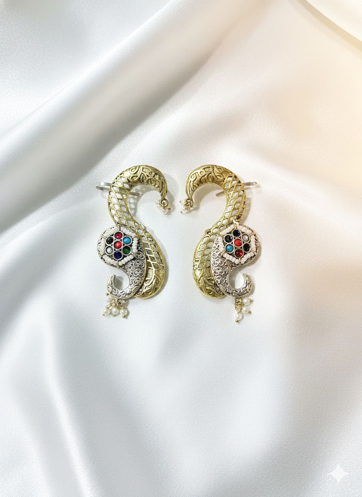 exquisite dual tone paisley motif statement earrings with ruby red stones and pearl accents exquisite dual tone paisley motif statement earrings with ruby red stones and pearl accents