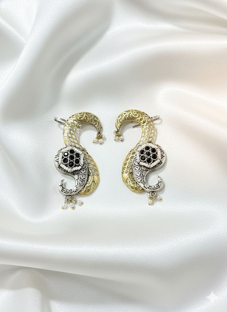 exquisite dual tone paisley motif statement earrings with ruby red stones and pearl accents exquisite dual tone paisley motif statement earrings with ruby red stones and pearl accents