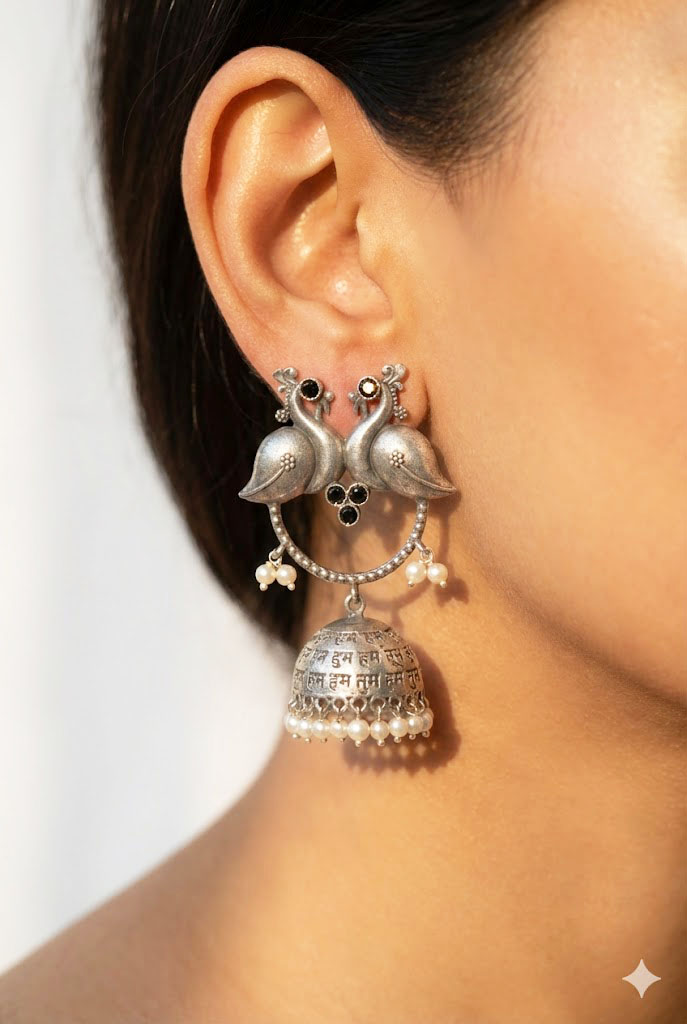 twin peacock oxidized silver jhumka earrings with pearl droplets twin peacock oxidized silver jhumka earrings with pearl droplets