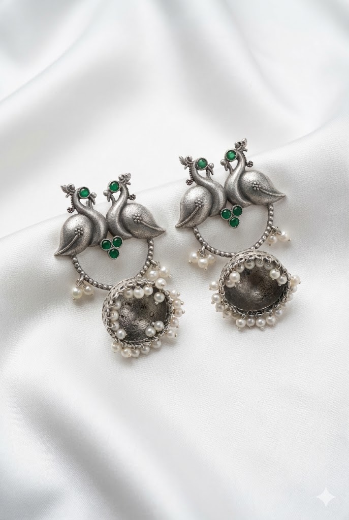 twin peacock oxidized silver jhumka earrings with pearl droplets twin peacock oxidized silver jhumka earrings with pearl droplets