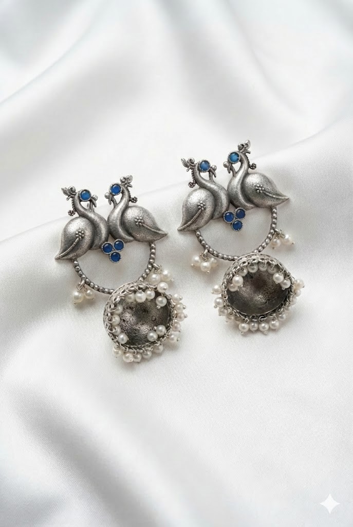 twin peacock oxidized silver jhumka earrings with pearl droplets twin peacock oxidized silver jhumka earrings with pearl droplets