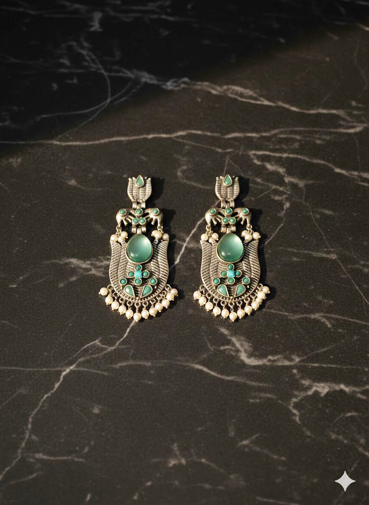 oxidized silver toned minakari drop earrings with green stones and pearl droplets oxidized silver toned minakari drop earrings with green stones and pearl droplets