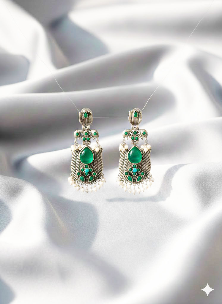 oxidized silver toned minakari drop earrings with green stones and pearl droplets oxidized silver toned minakari drop earrings with green stones and pearl droplets