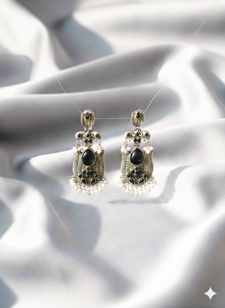 oxidized silver toned minakari drop earrings with green stones and pearl droplets oxidized silver toned minakari drop earrings with green stones and pearl droplets